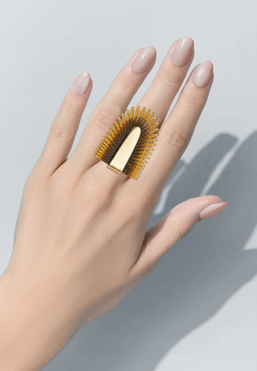 Gretchen Pam Pem Ring in yellow worn on the hand